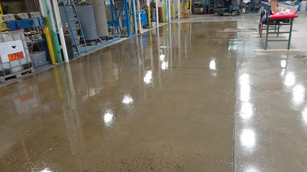 Sealed and polished concrete floor in an industrial manufacturing plant by Core Floorings Inc