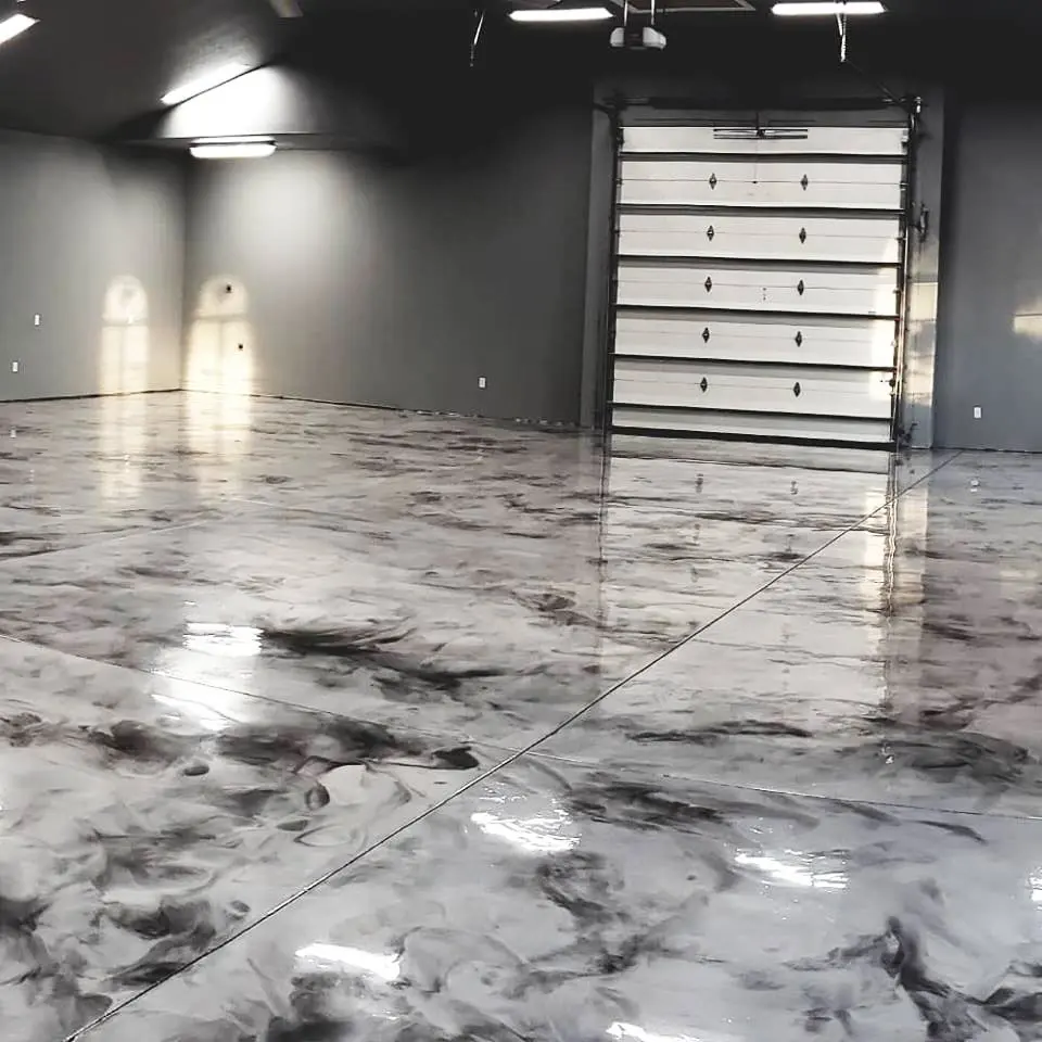 Silver and charcoal metallic epoxy floor in a large garage shop by Core Floorings Inc
