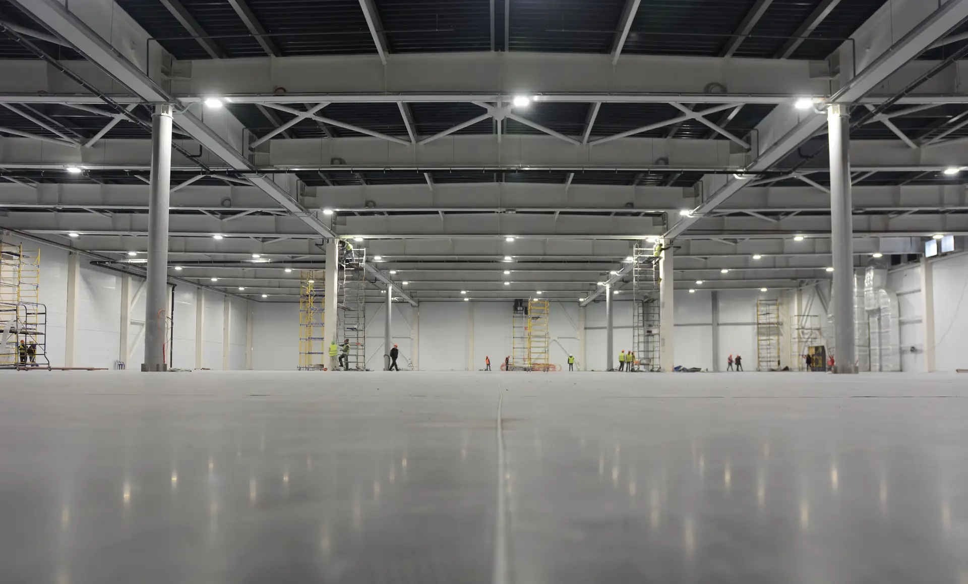 Large concrete warehouse floor ground and polished by Core Floorings Inc